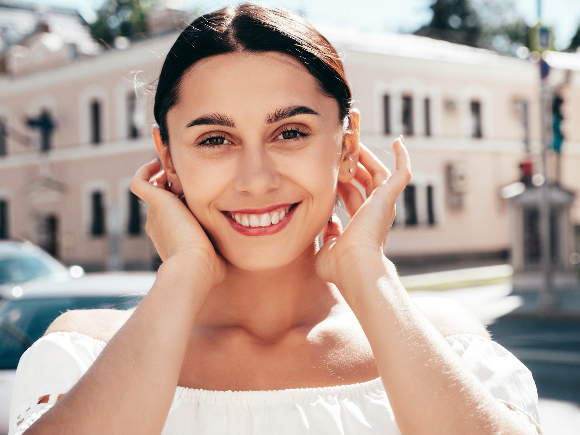 Young beautiful woman posing outdoors